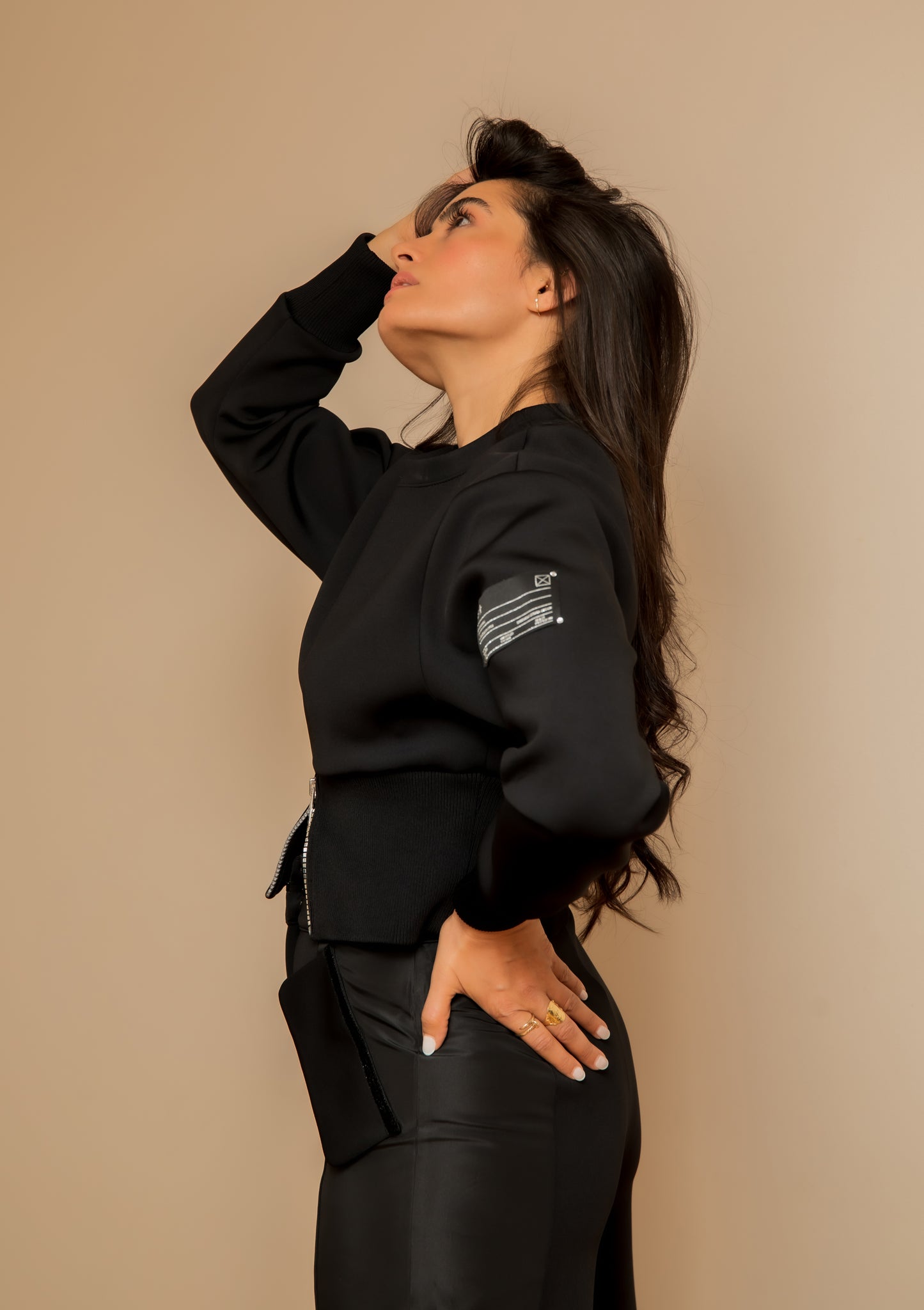 Black sweater with label detail