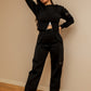 Black sweater with label detail