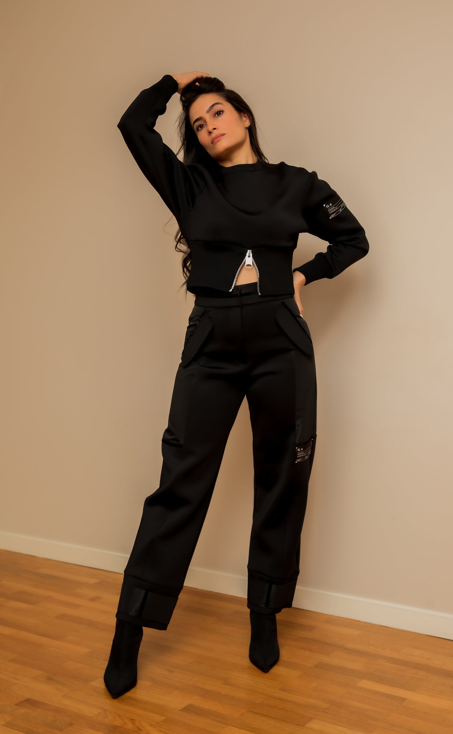 Black sweater with label detail