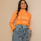 Top orange avec col roulé